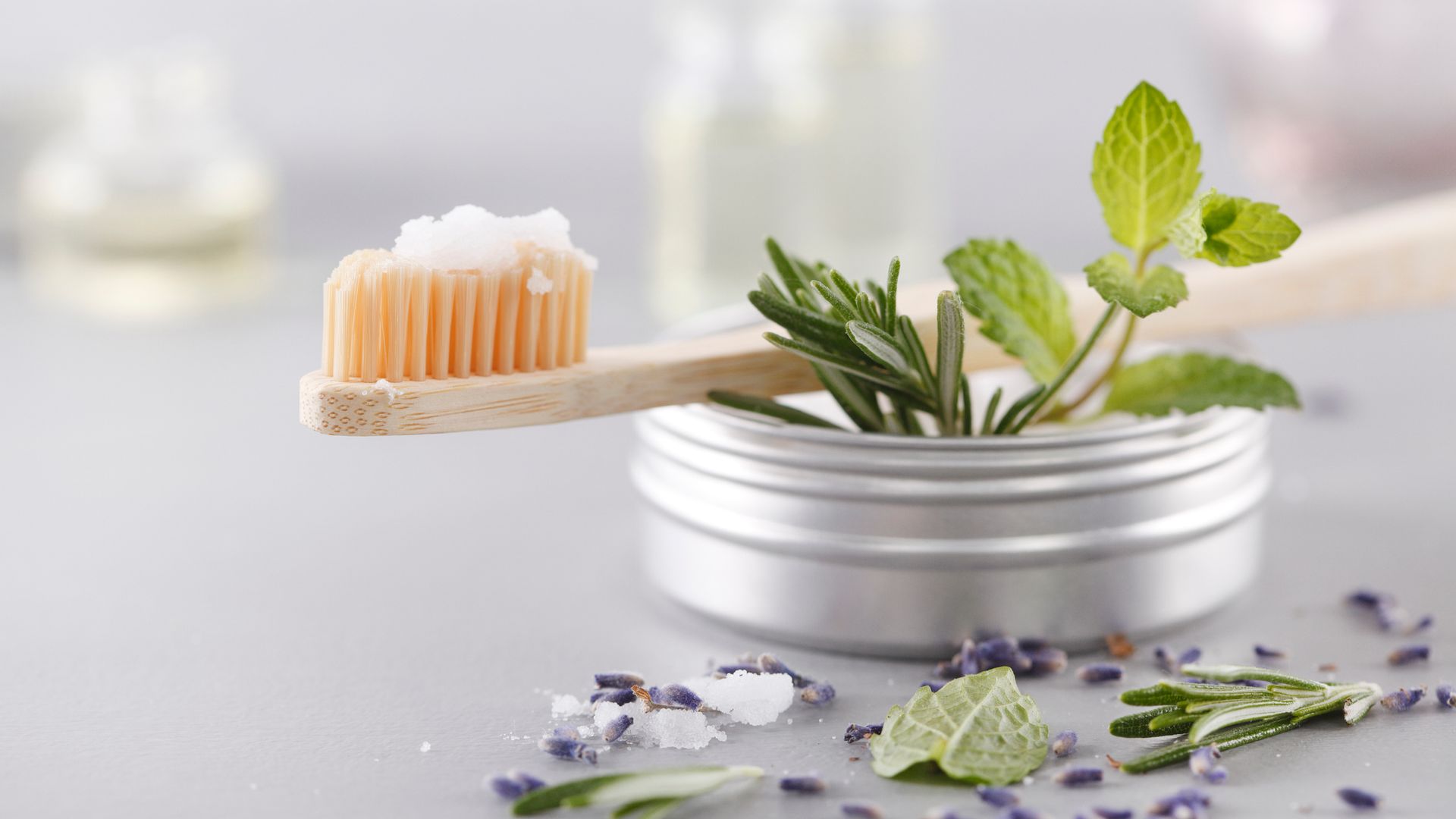 Bamboo toothbrush with natural salt toothpaste and herbs.