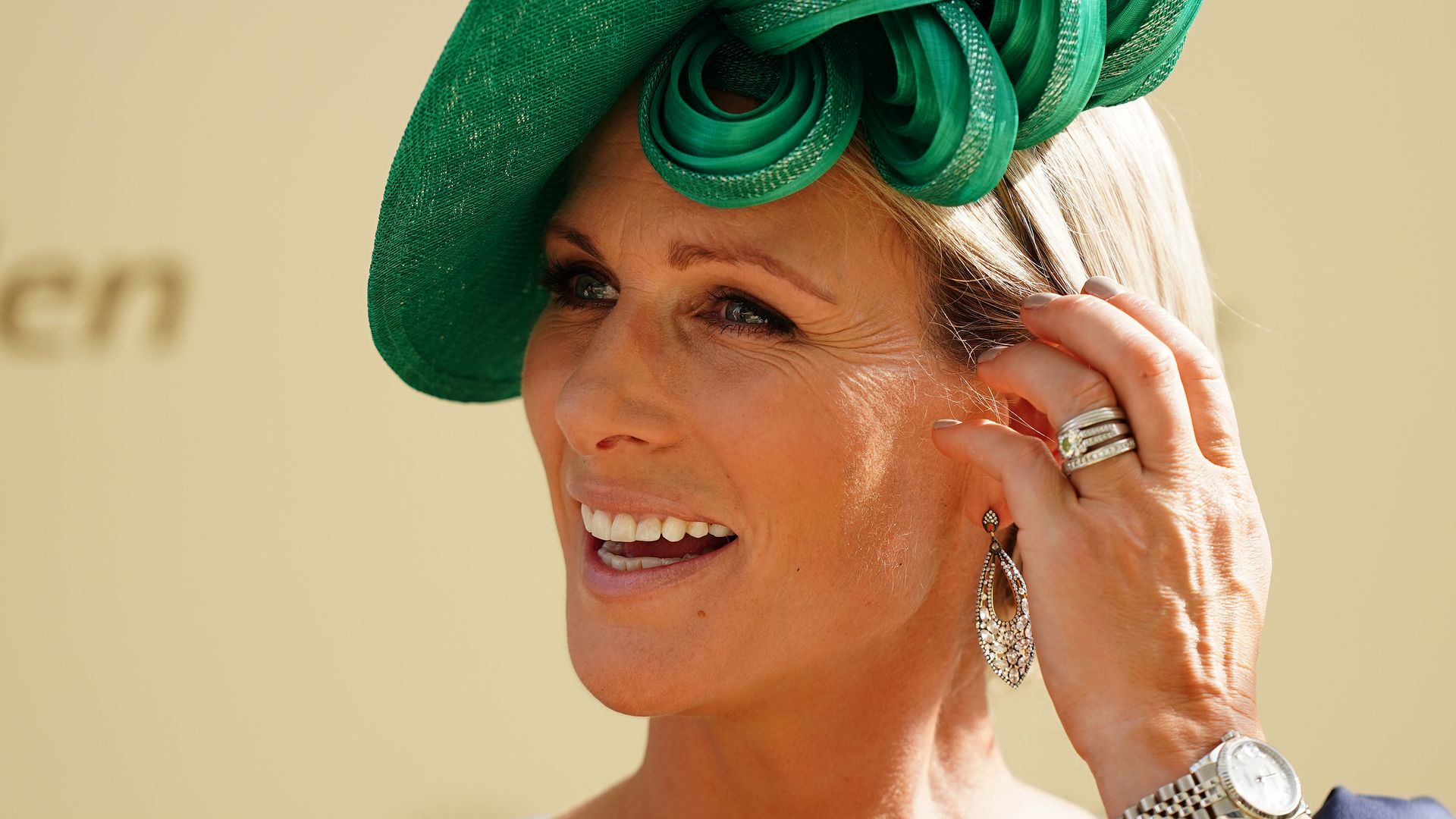Zara Tindall in a blue dress and green hat at Royal Ascot 2023