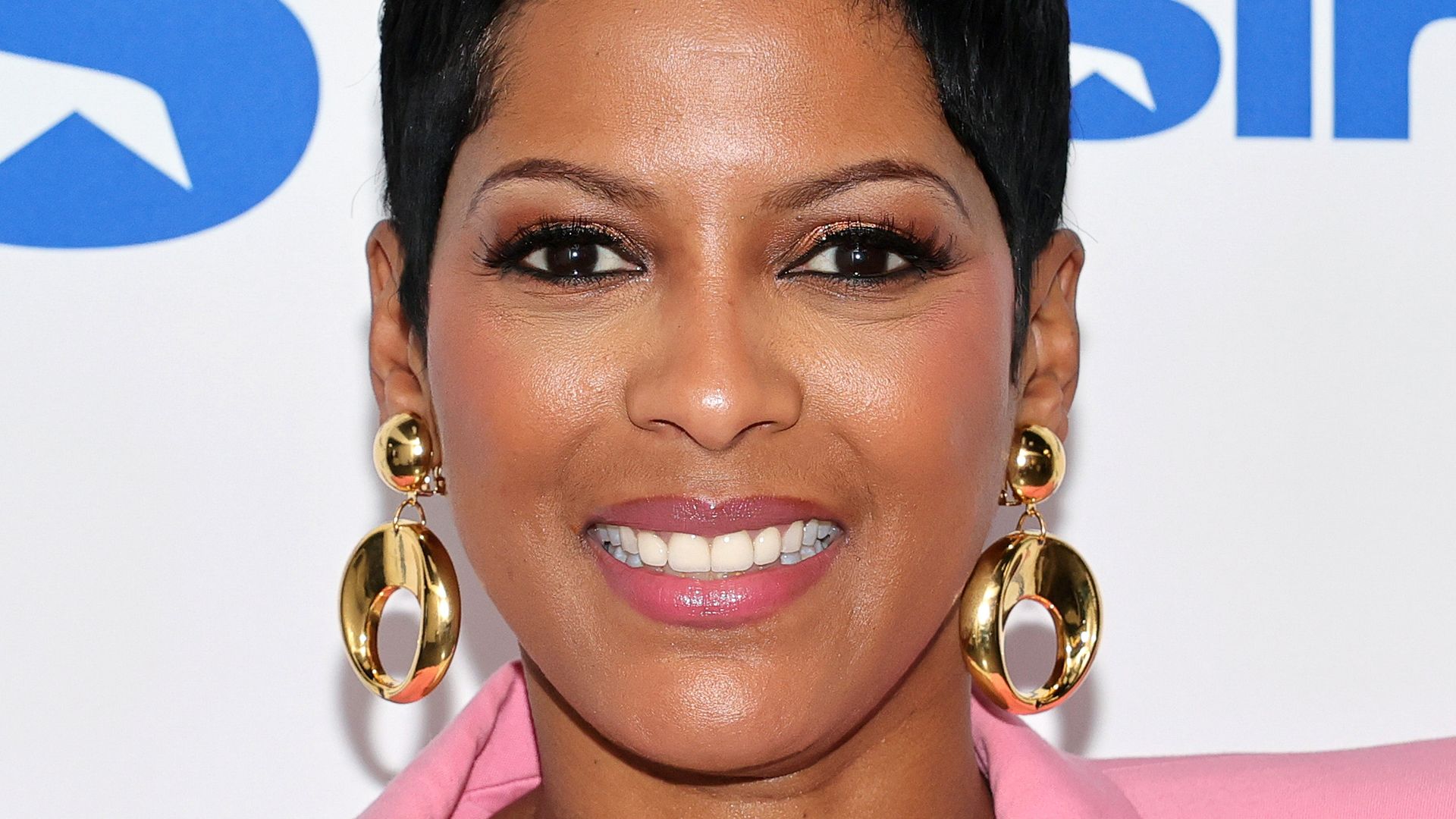 Tamron Hall smiling pink blazer earrings