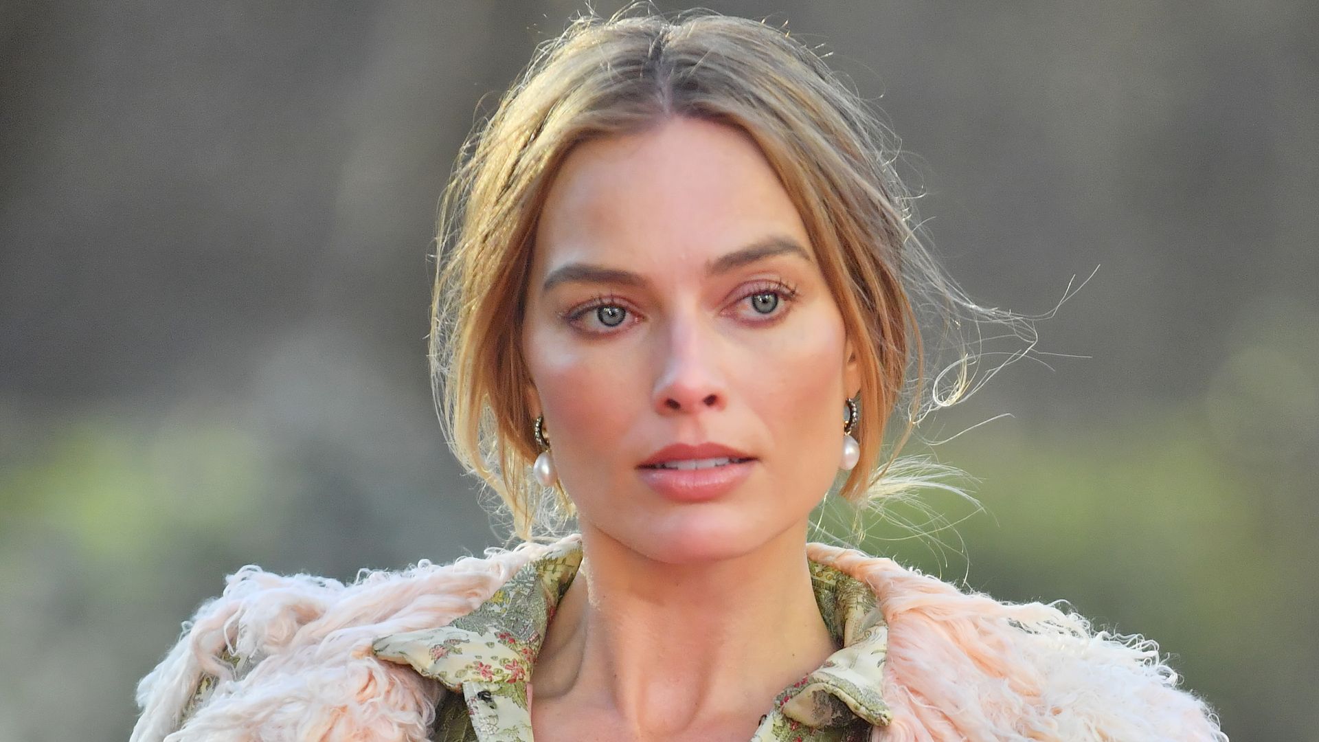 Margot Robbie braves the UK weather in 'naked' corset - and it's her most risqué look yet