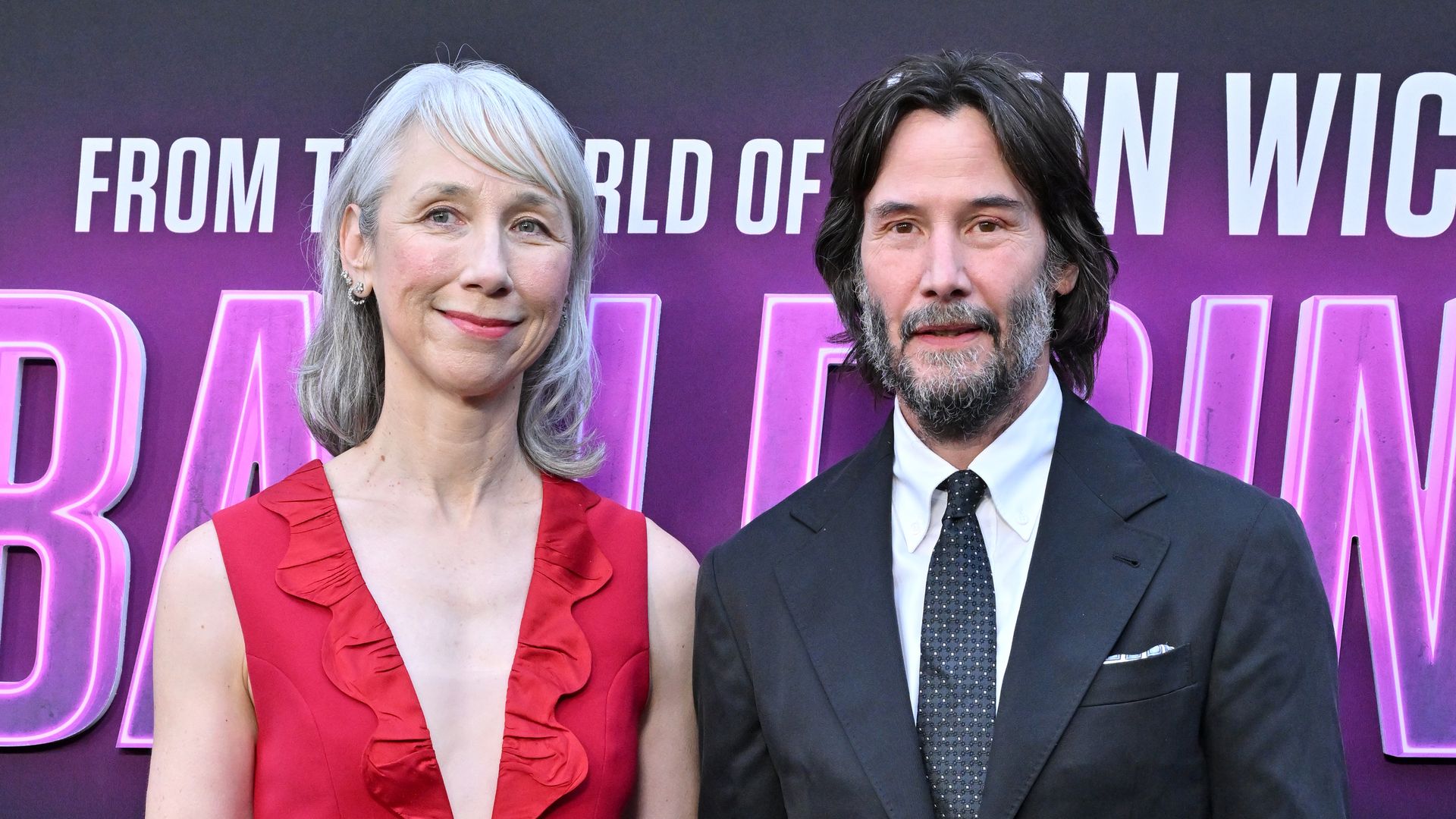 photo of keanu reeves and alexandra grant holding hands on red carpet