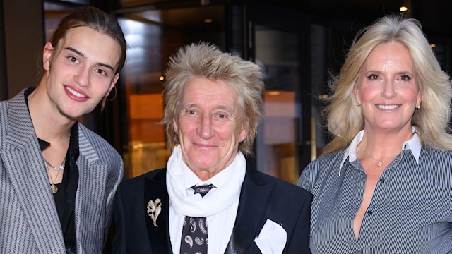 Alastair Wallace Stewart, Rod Stewart and Penny Lancaster pose in grey and black outfits