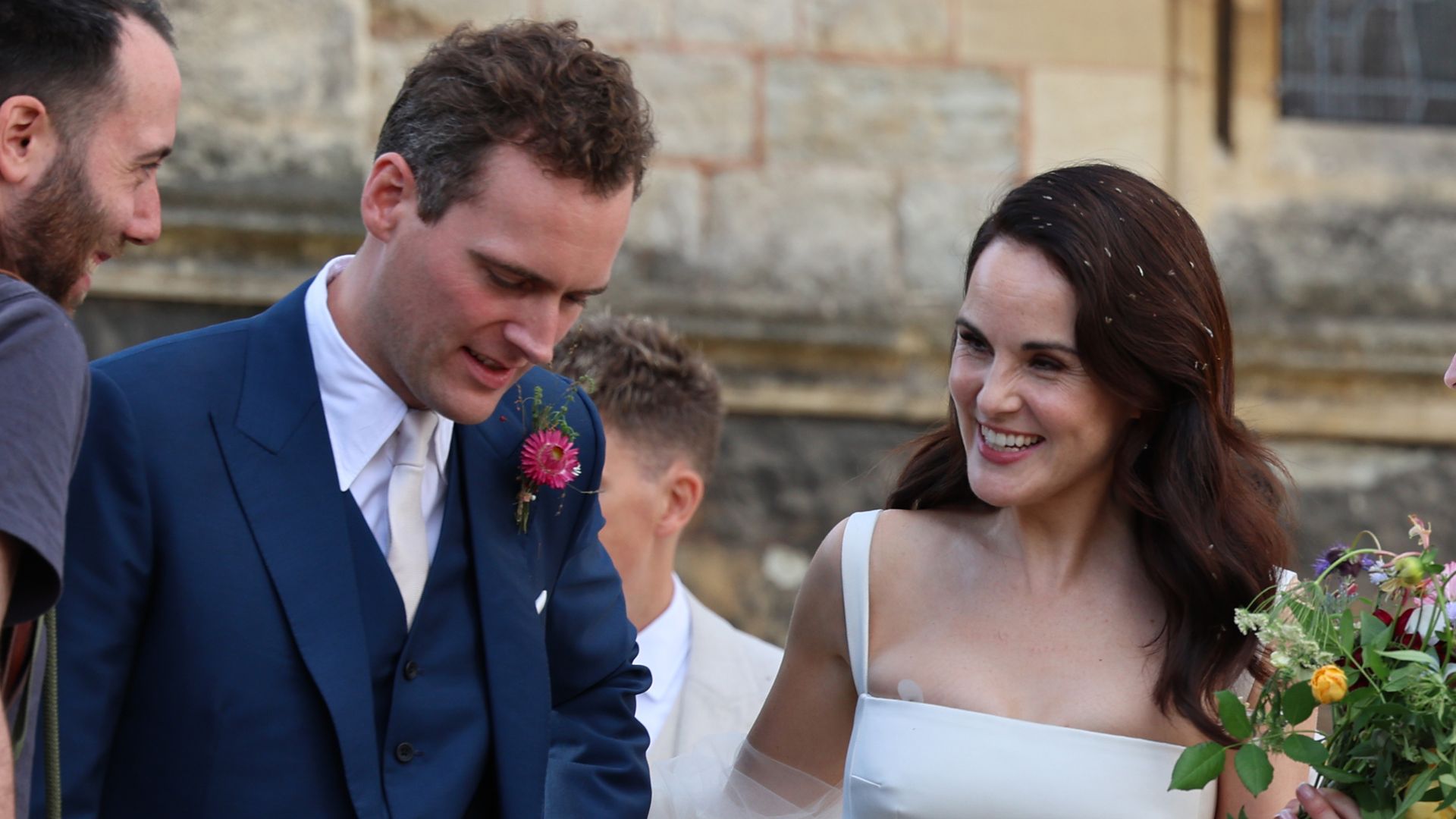 Downton Abbey star Michelle Dockery stuns in satin white gown as she marries Jasper Waller-Bridge in front of glittering crowd - photos