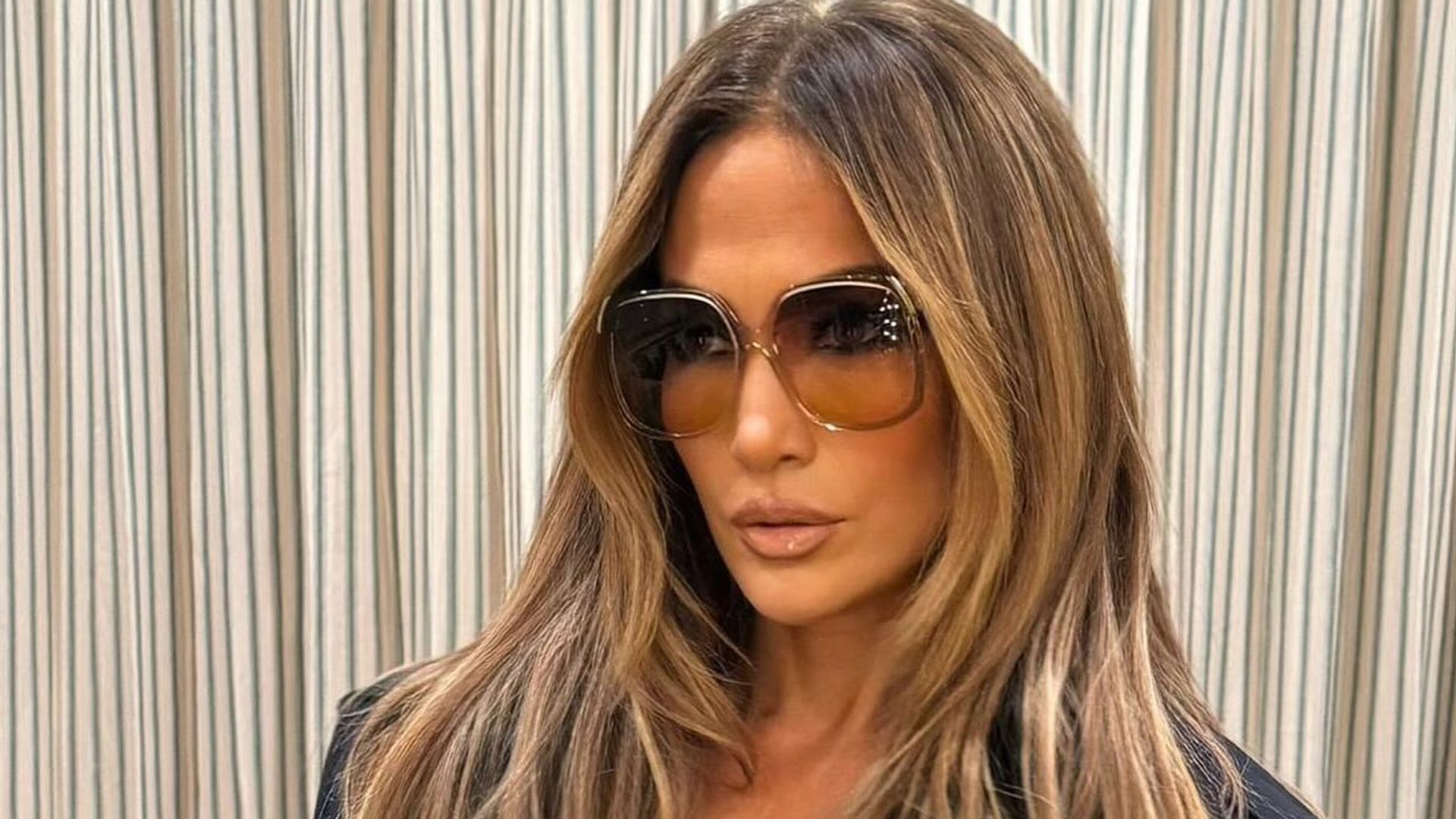 Jennifer Lopez stuns in micro mini skirt and thigh-high boots combo