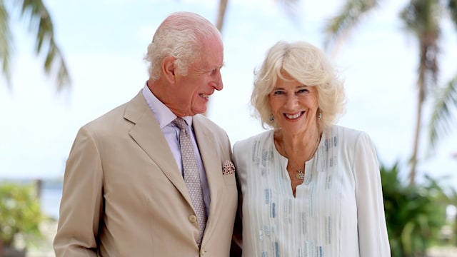 King Charles III and Queen Camilla smile during a visit to a beach on October 25, 2024 in Apia, Samoa