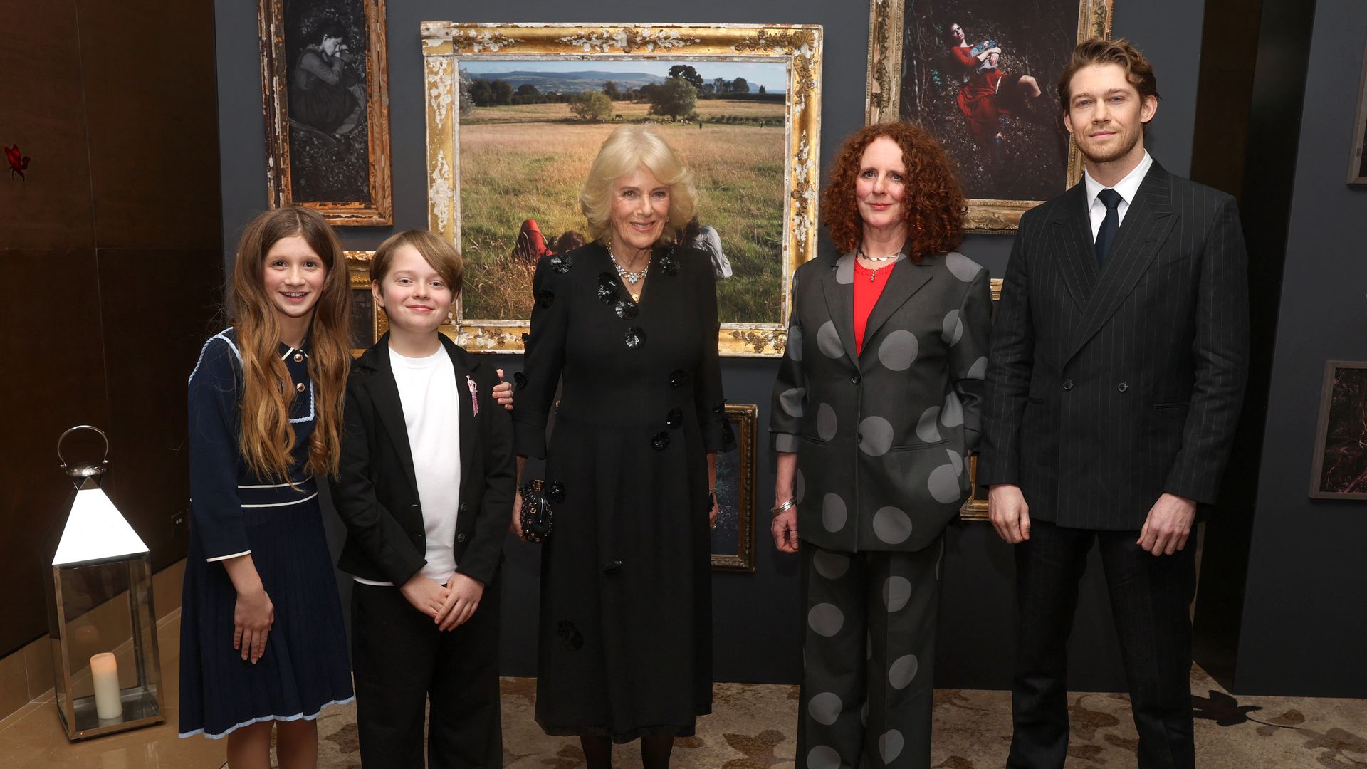 Queen Camilla poses with actor Olivia Lynes (L), actor Jacobi Jupe (2L), author Maggie O'Farrell (2R) and actor Joe Alwyn 