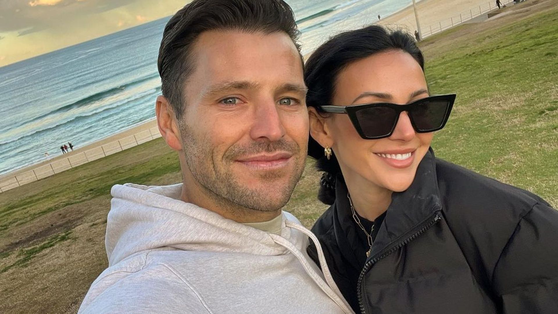 Mark and Michelle posing for a selfie at the beach