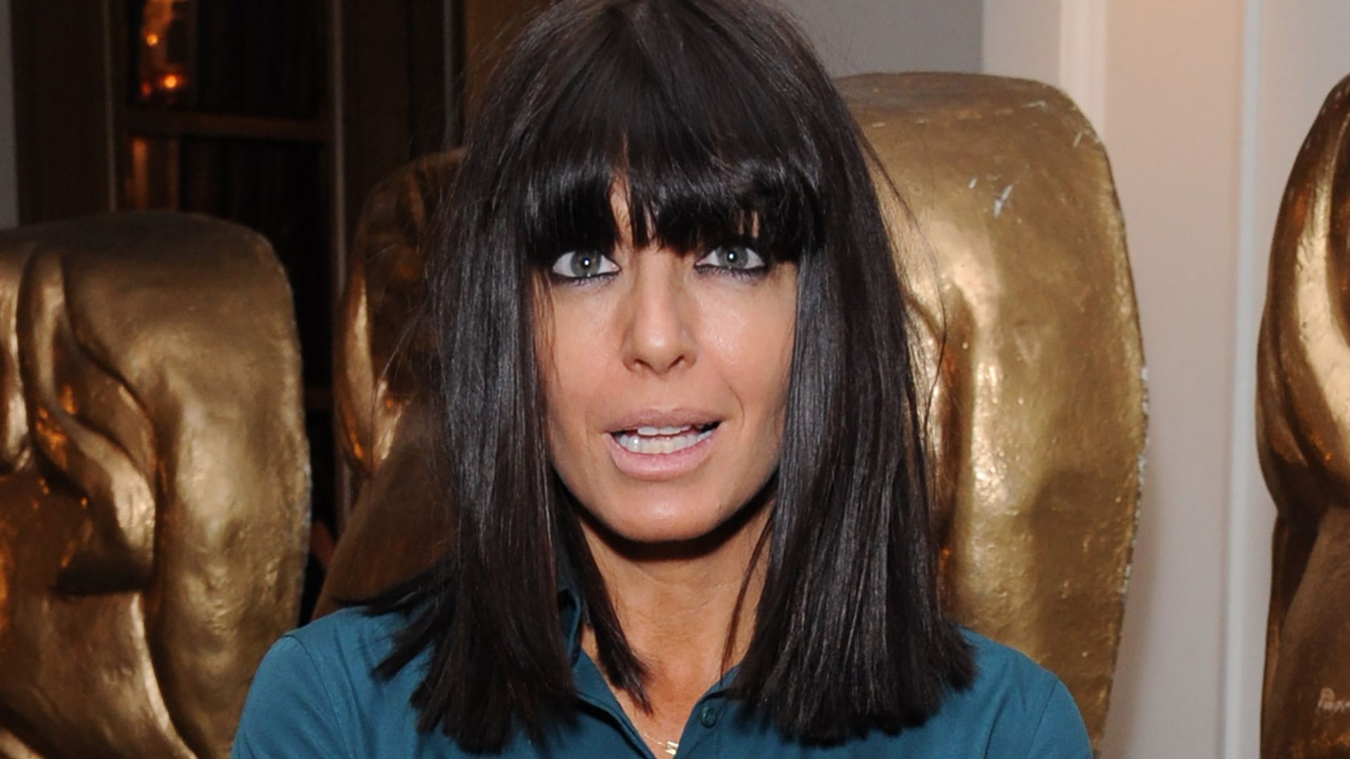 Claudia Winkleman surprises in plunging bridesmaid dress and short choppy bob