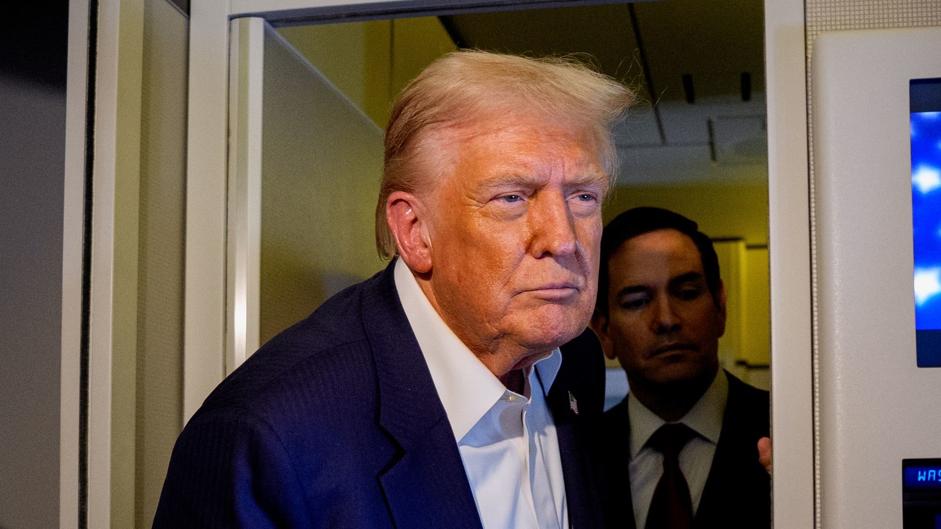 U.S. President Donald Trump, accompanied by U.S. Secretary of State Marco Rubio, (2nd R), U.S. Treasury Secretary Scott Bessent (L), and U.S. Trade Representative Jamieson Greer (R), speaks to members of the media aboard Air Force One on October 27, 2025, in flight