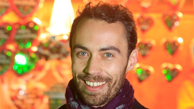 james middleton smiling with blazer and purple scarf