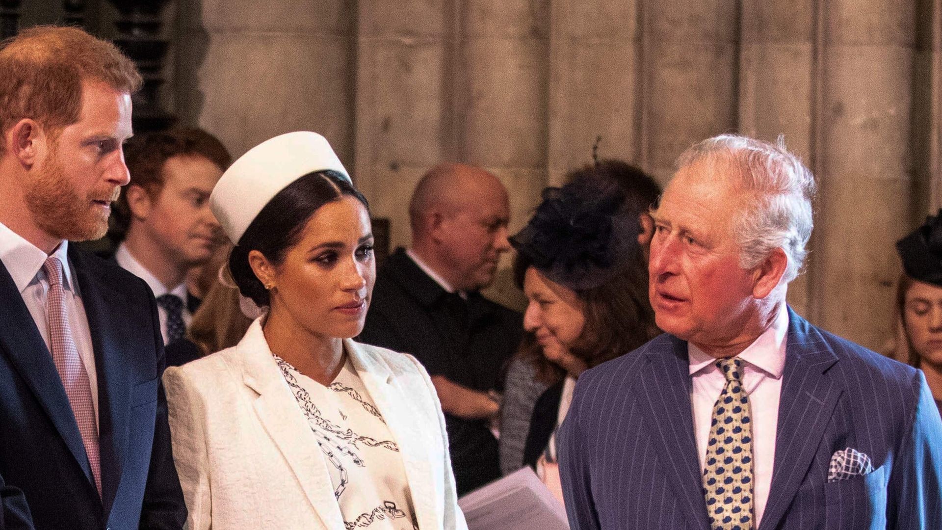 Prince Harry and Meghan talking to King Charles