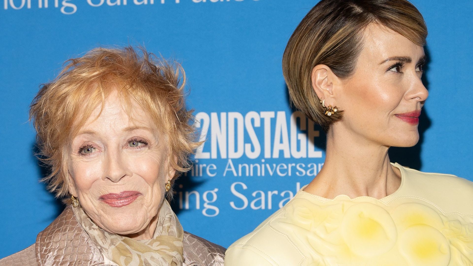 Holland Taylor in a beige outfit with Sarah Paulson in yellow