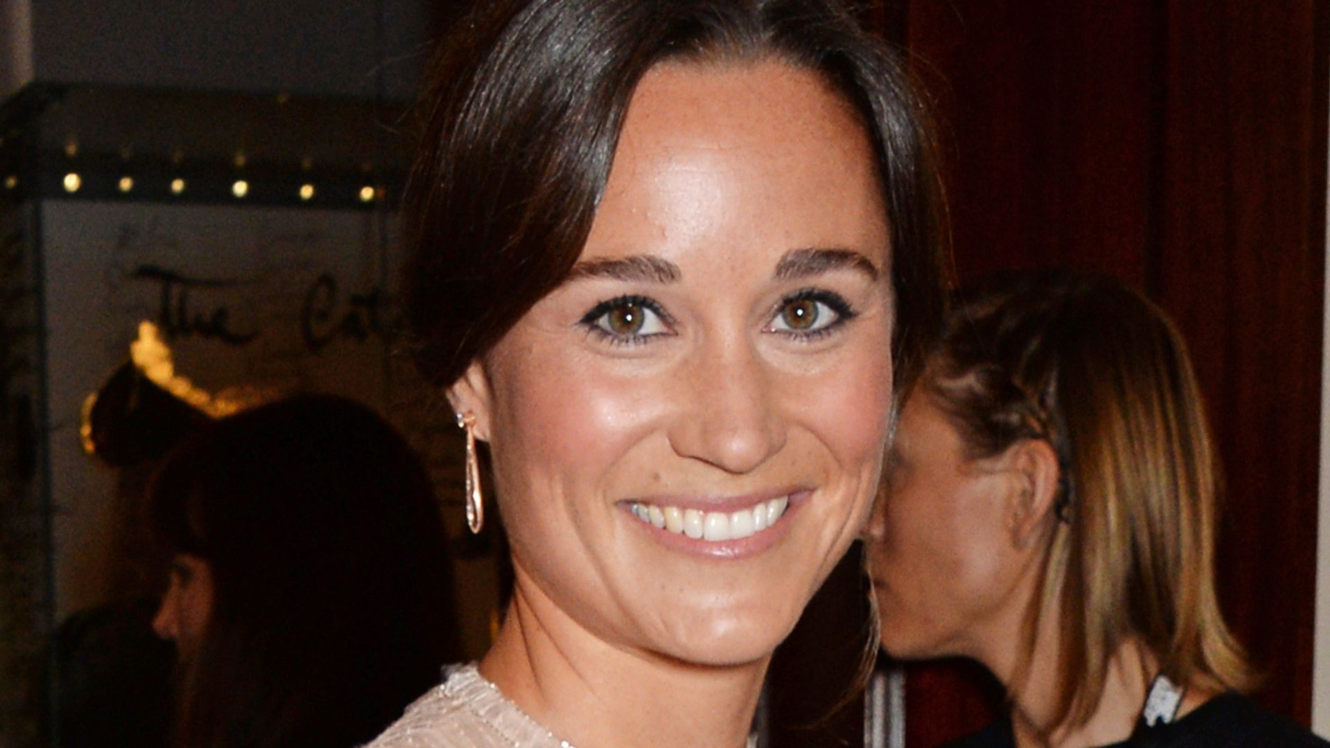 Pippa Middleton in a sparkly dress with her hair up