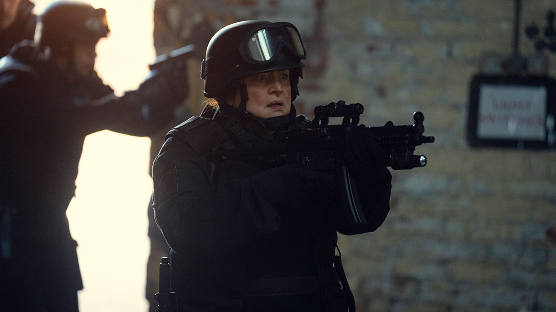 police officer holding gun