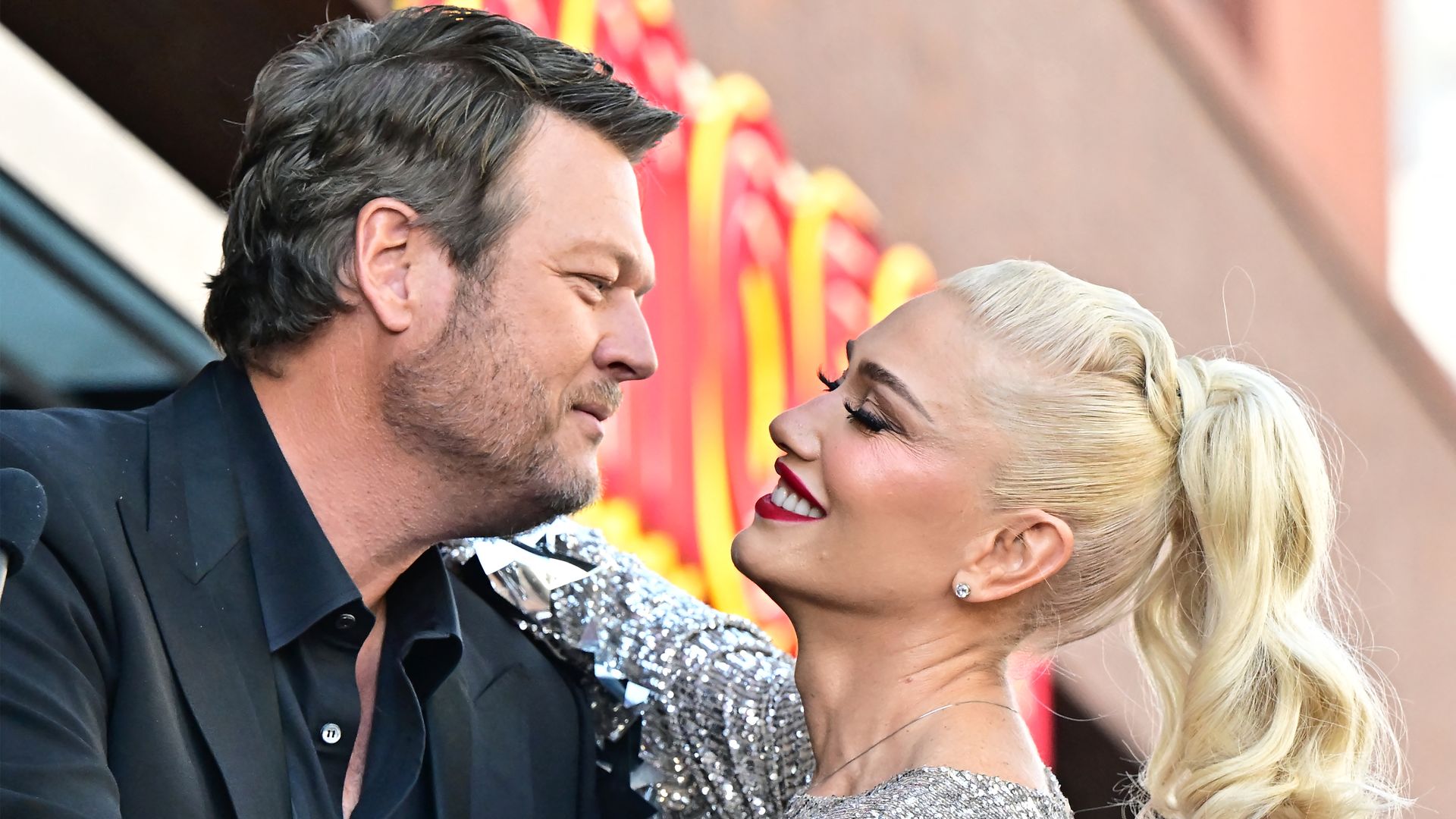 US singer Gwen Stefani and her husband US singer Blake Shelton embrace during her Hollywood Walk of Fame Star ceremony on Hollywood, California, on October 19, 2023