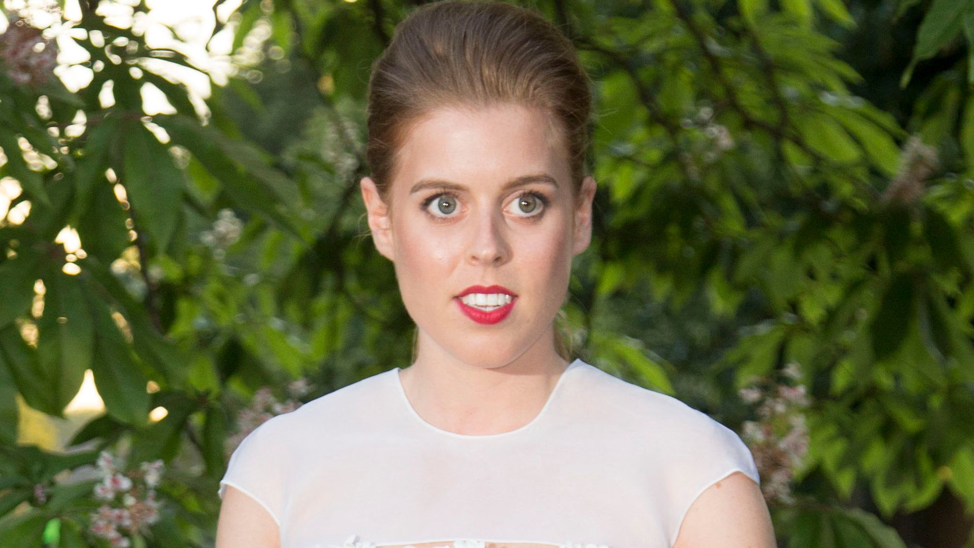  Princess Beatrice attends the annual Serpentine Galley Summer Party in white wedding dress in July 2014