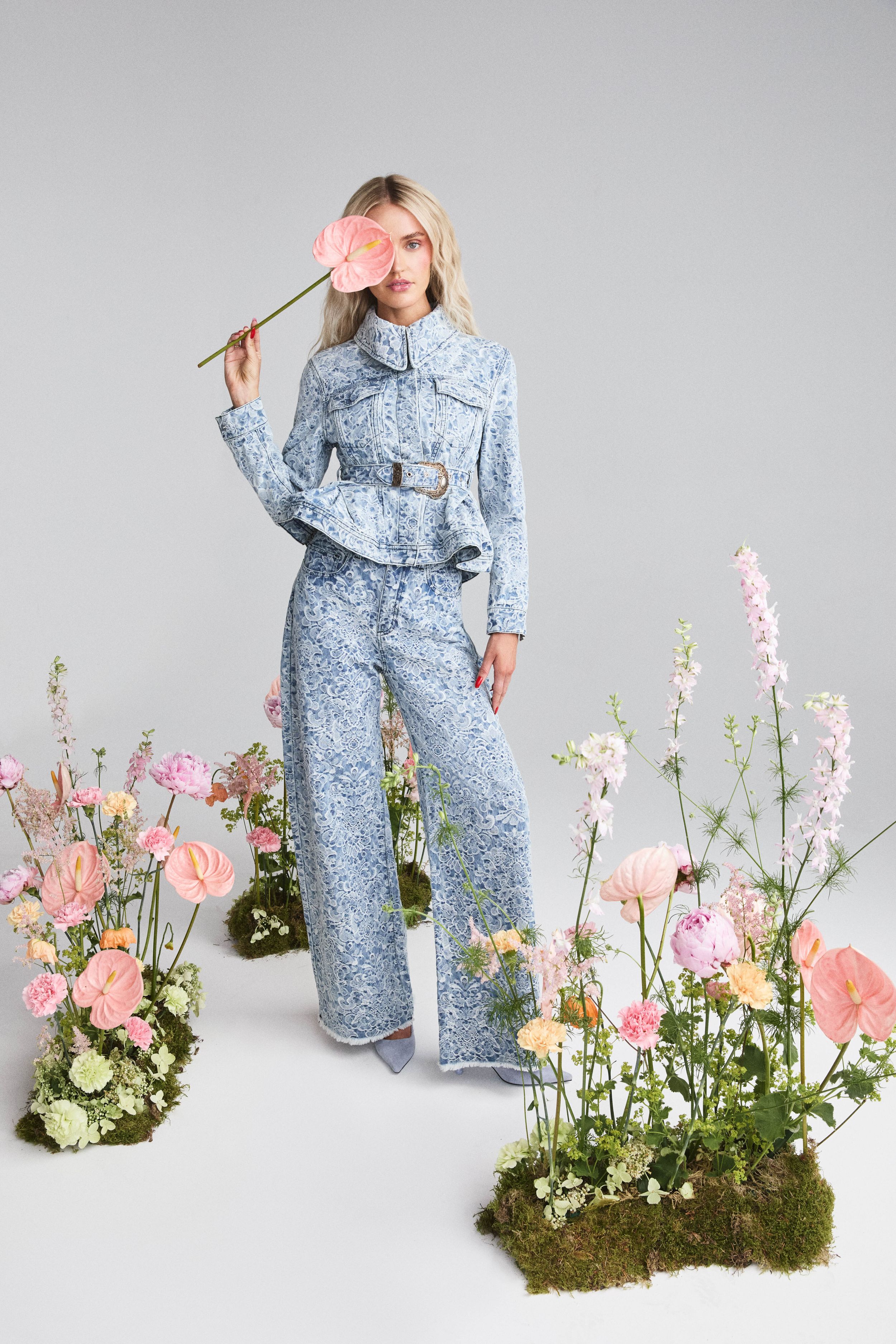 morgan riddle wearing Jacket: Brocade Denim Fitted Jacket with Embellishment, £575, Marques'Almeida, Trousers: Brocade Denim Boyfriend Trousers, £345, Marques'Almeida,Heels: Ixia 80 Suede in Light Blue Haze, £750, Jimmy Choo