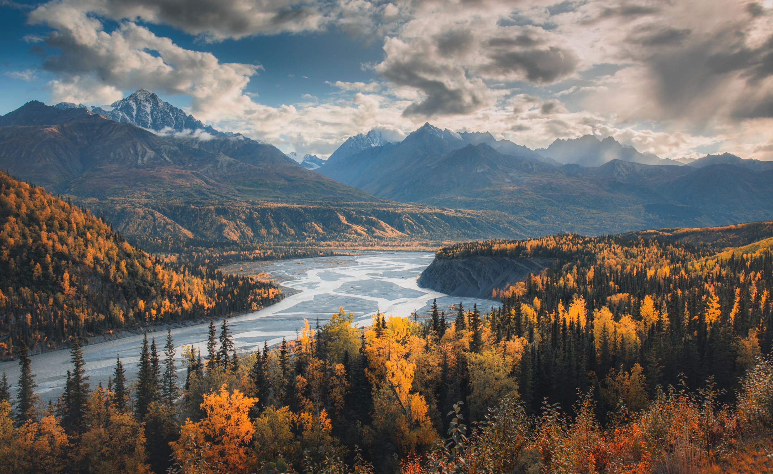 Alaska glacial river with autumn foliages and mountain