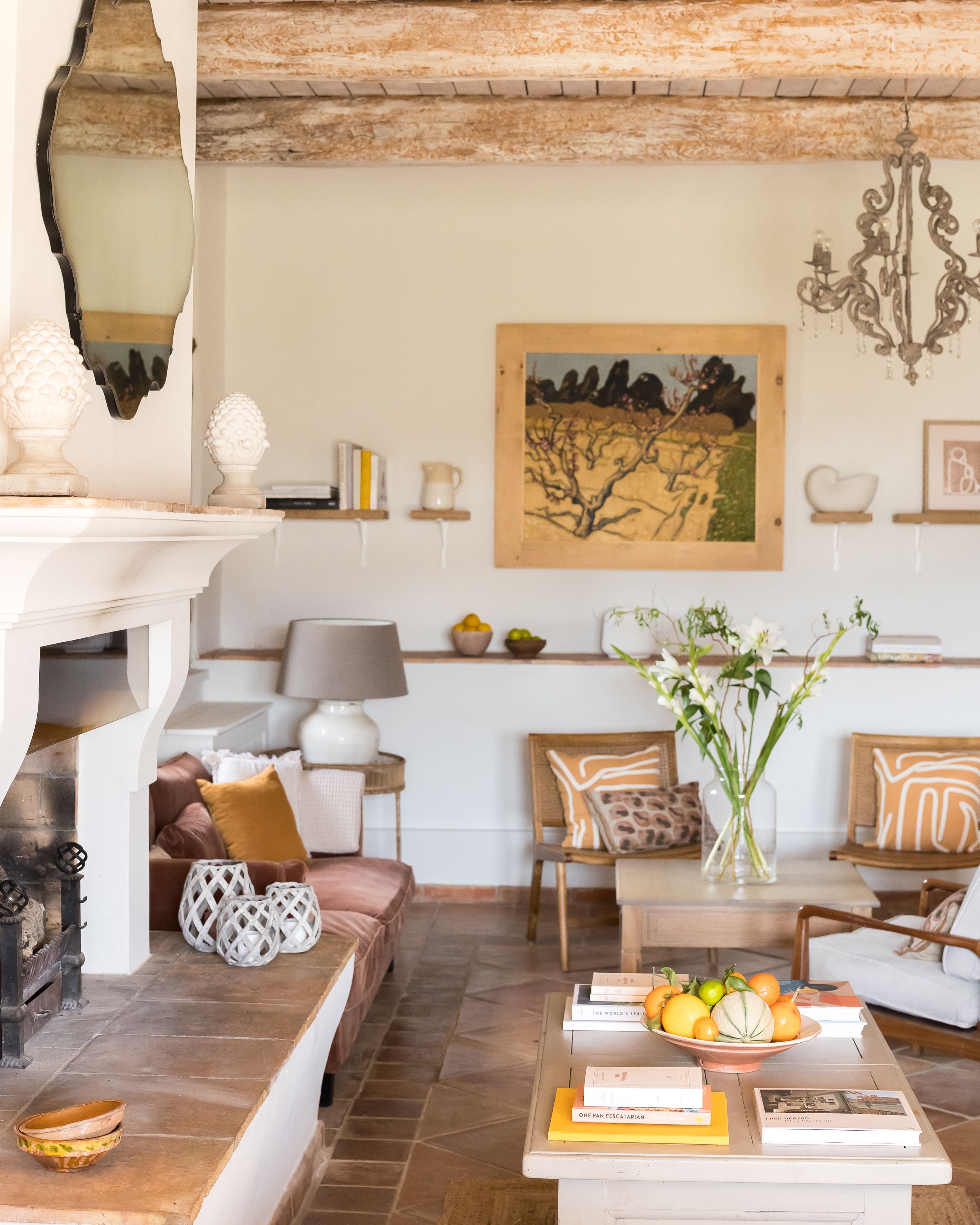 The bastide in Domaine Mirabeau is filled with natural light and has an orange and brown shaded colour scheme 