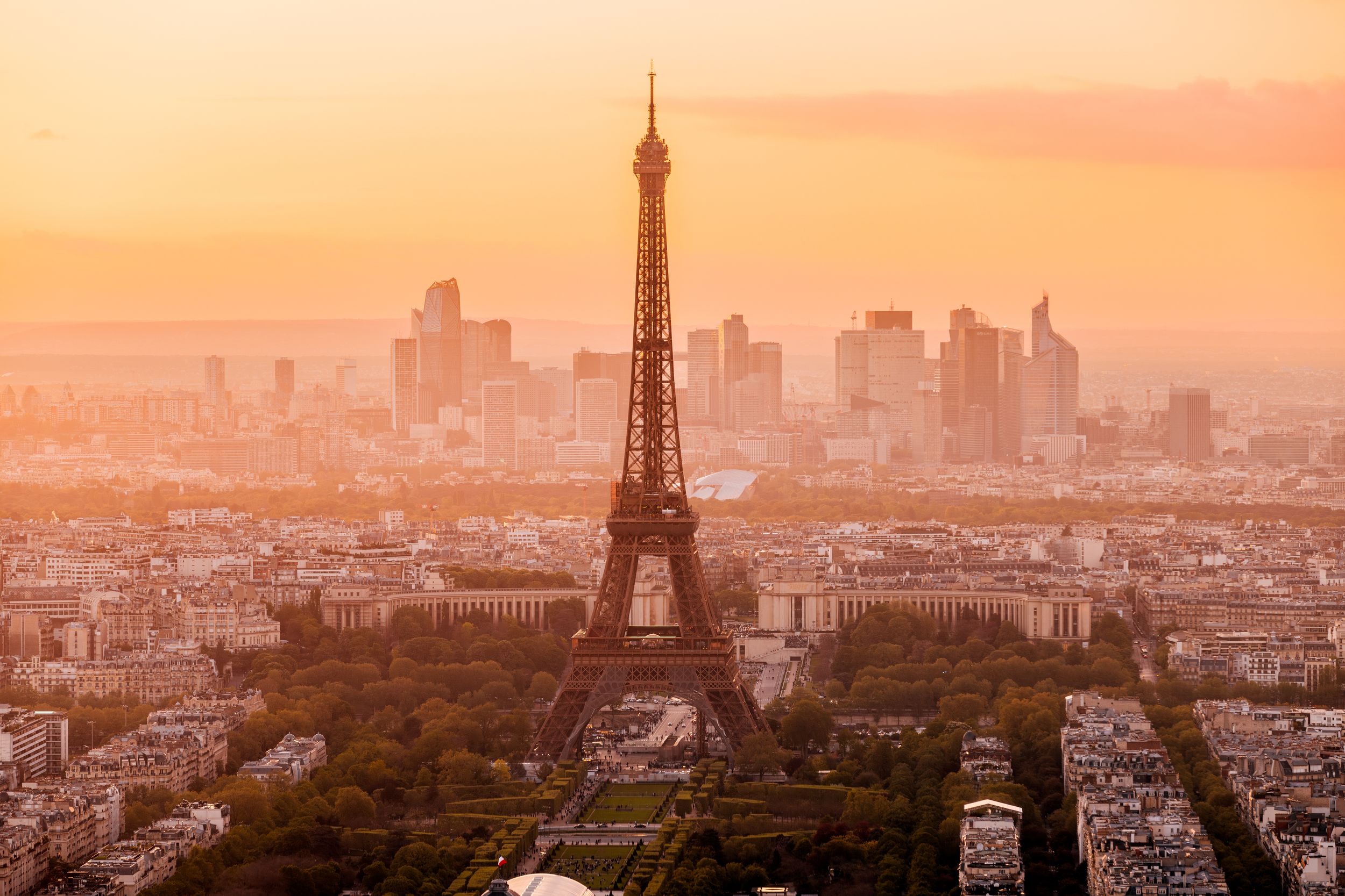 Eiffel Tower and La Defense business district at sunset, aerial view, Paris, France