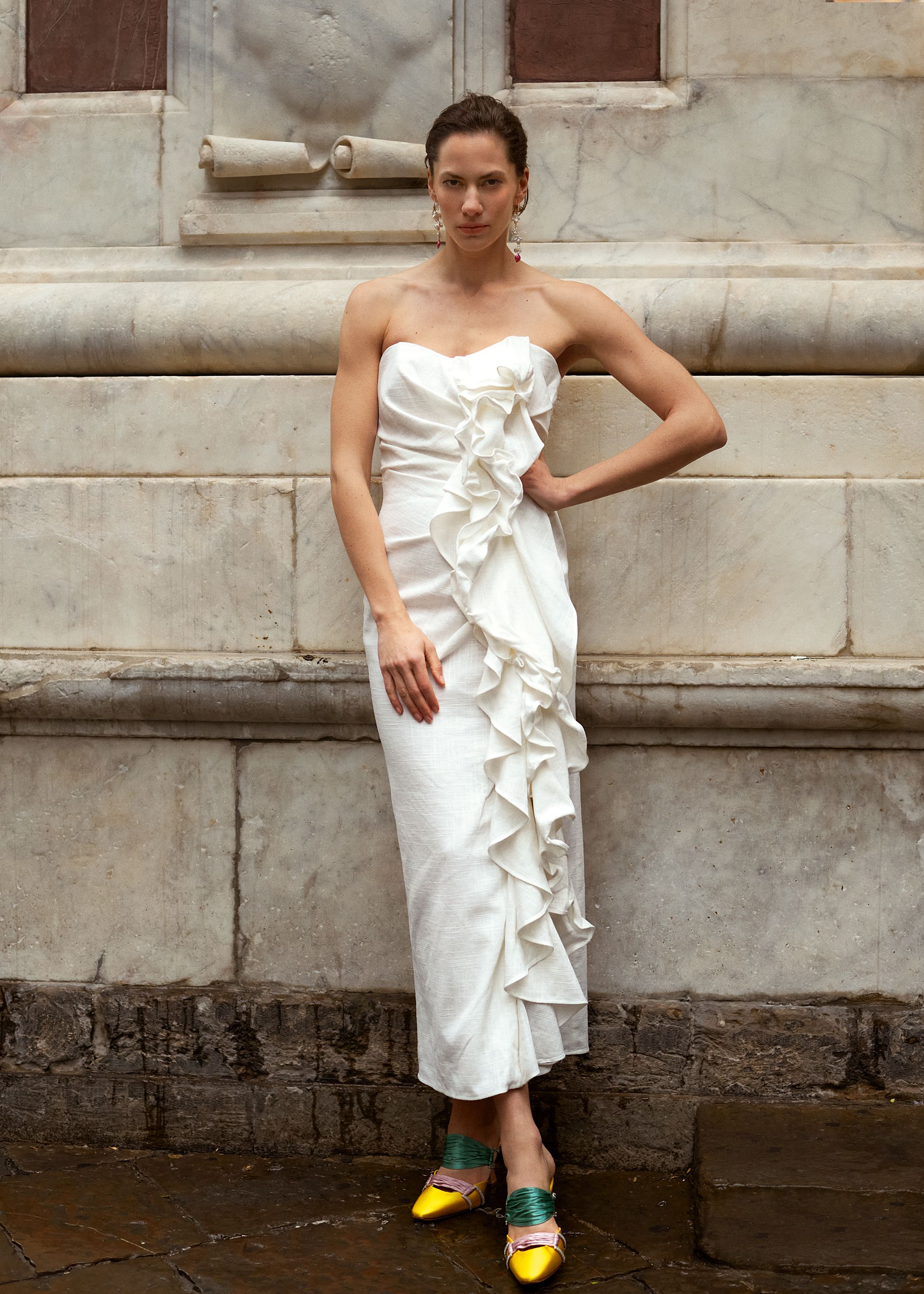 Linen dress with ruffles from The 2nd Skin Co; earrings, BPCR Studio; satin mules, Manolo Blahnik