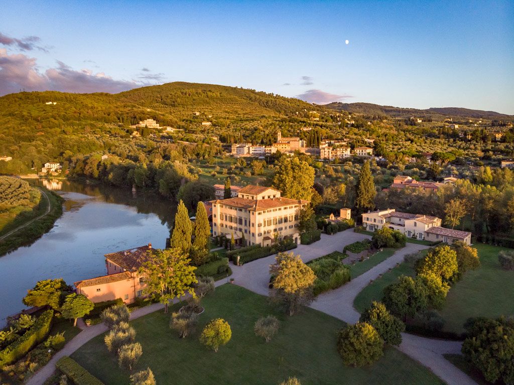 Shot of villa in tuscany hills with blue sky in the background