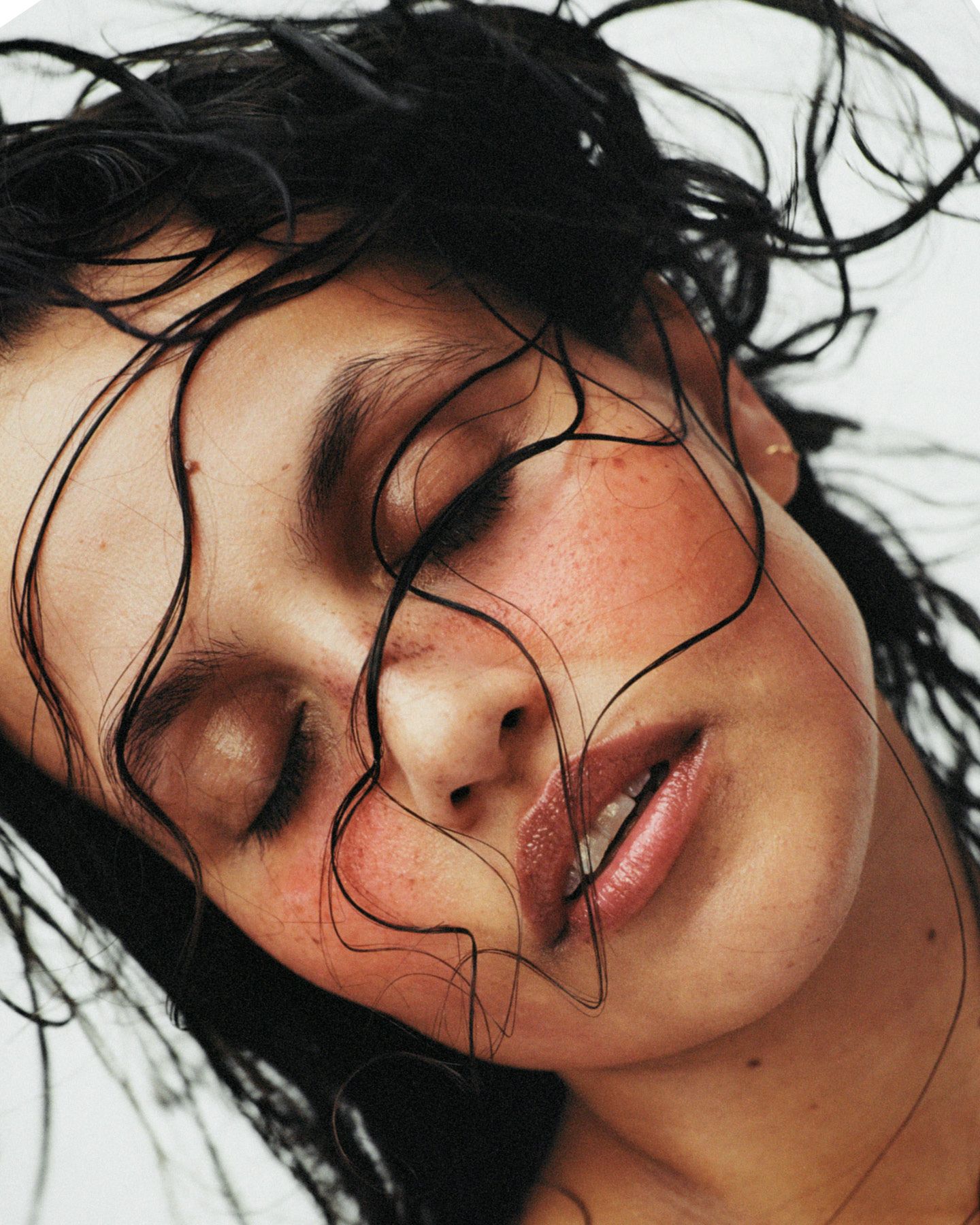 Mantle skincare a woman with her hair flying in the wind