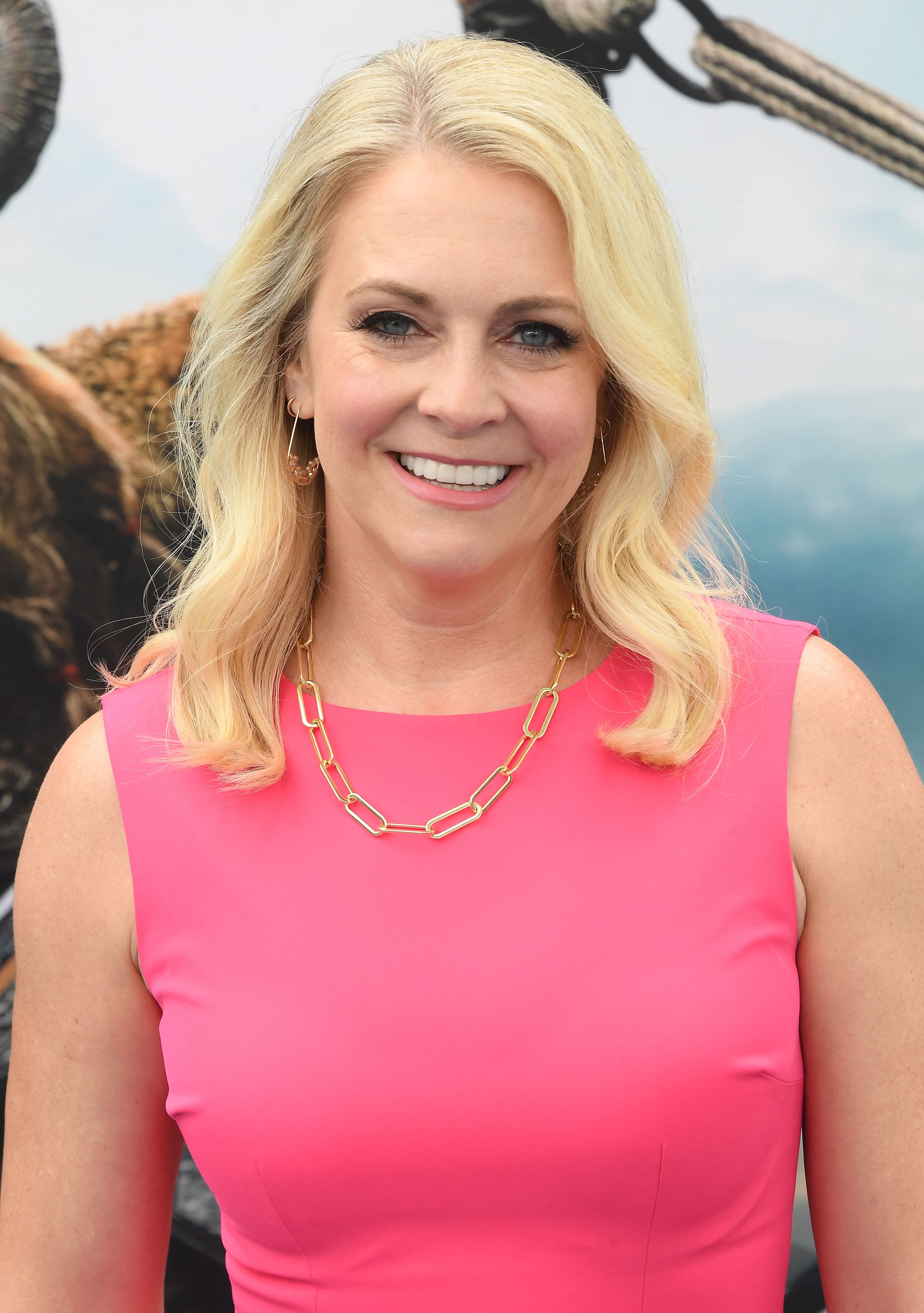 Melissa Joan Hart in a bright pink dress