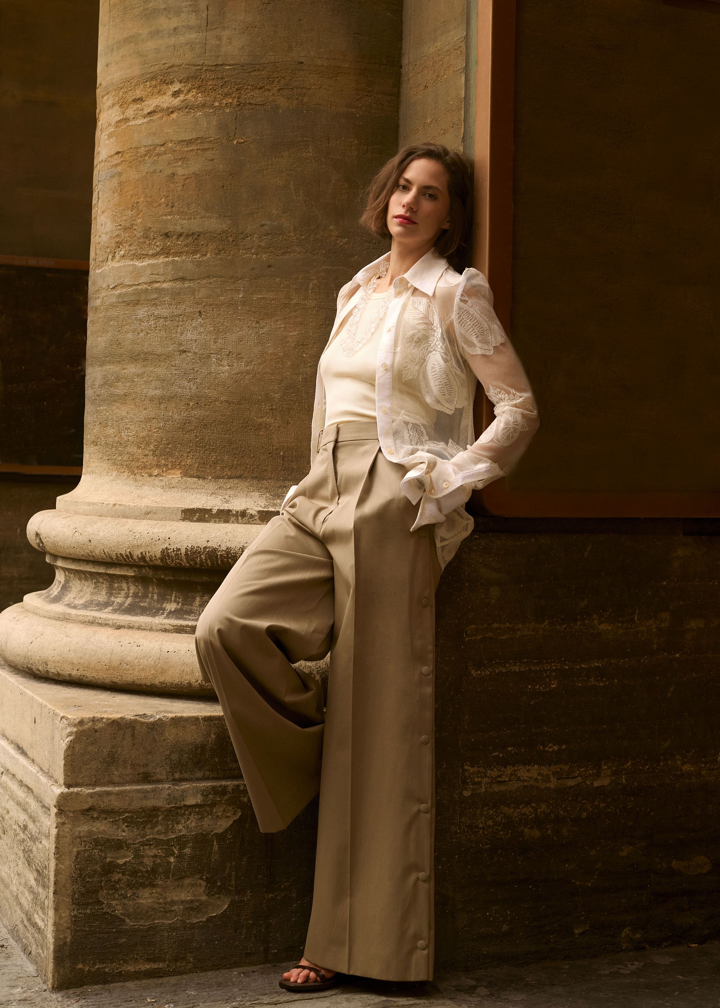 Top and shirt, Sportmax; trousers and sandals, Max Mara; necklace, BPCR Studio. 
