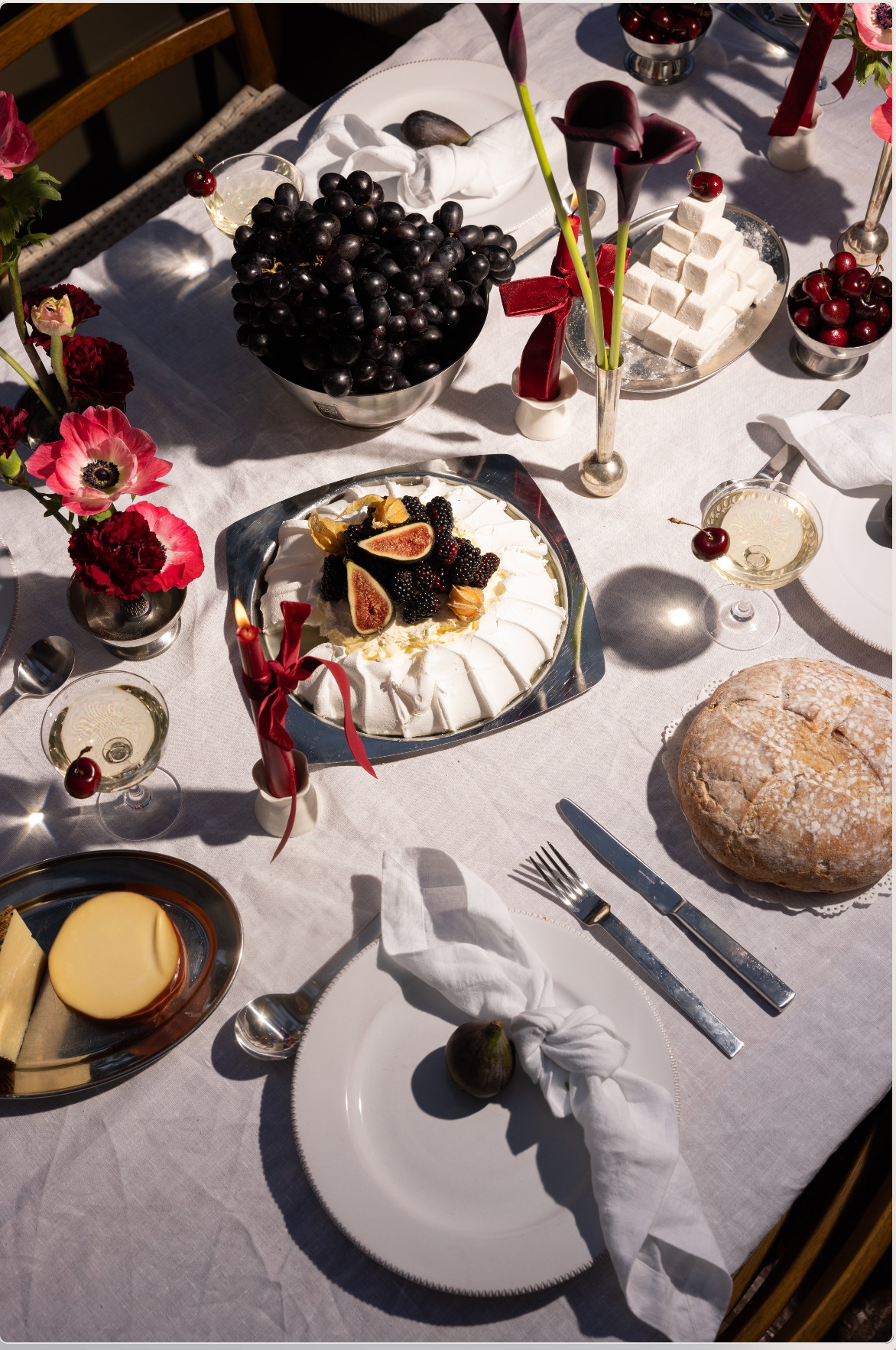 Silverware: eBay, Silver vase: Etsy , Napkins, Candle stick holders, glasses, plates and cutlery: all Glassette