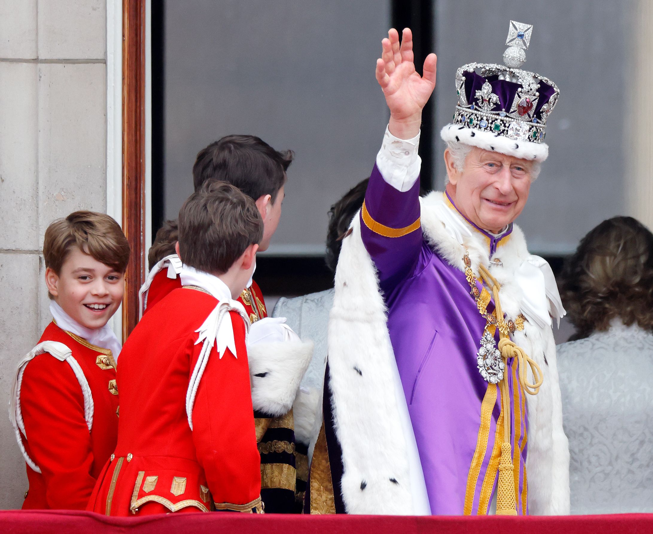Prince George smiling with King Charles on balcony at coronation