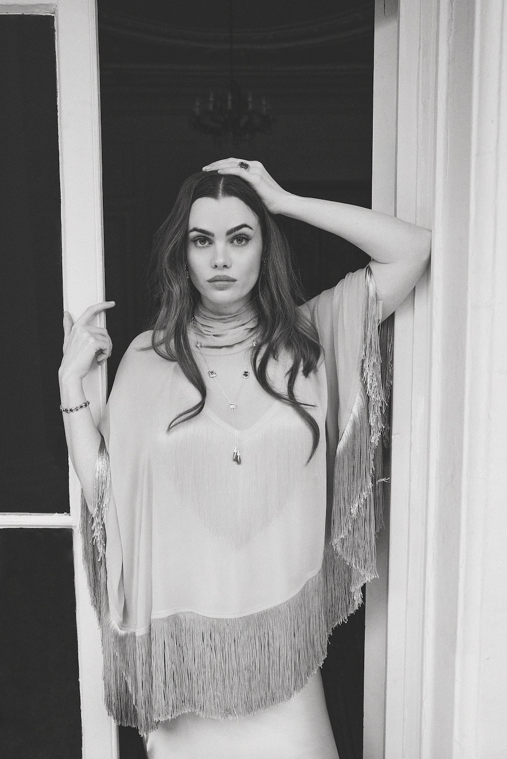 Poncho, £390, Top, £350, Skirt, £350, all De La Vali, Earrings, £360, Necklace, £540, Bracelet, £630, Ring, £250, all Thomas Sabo