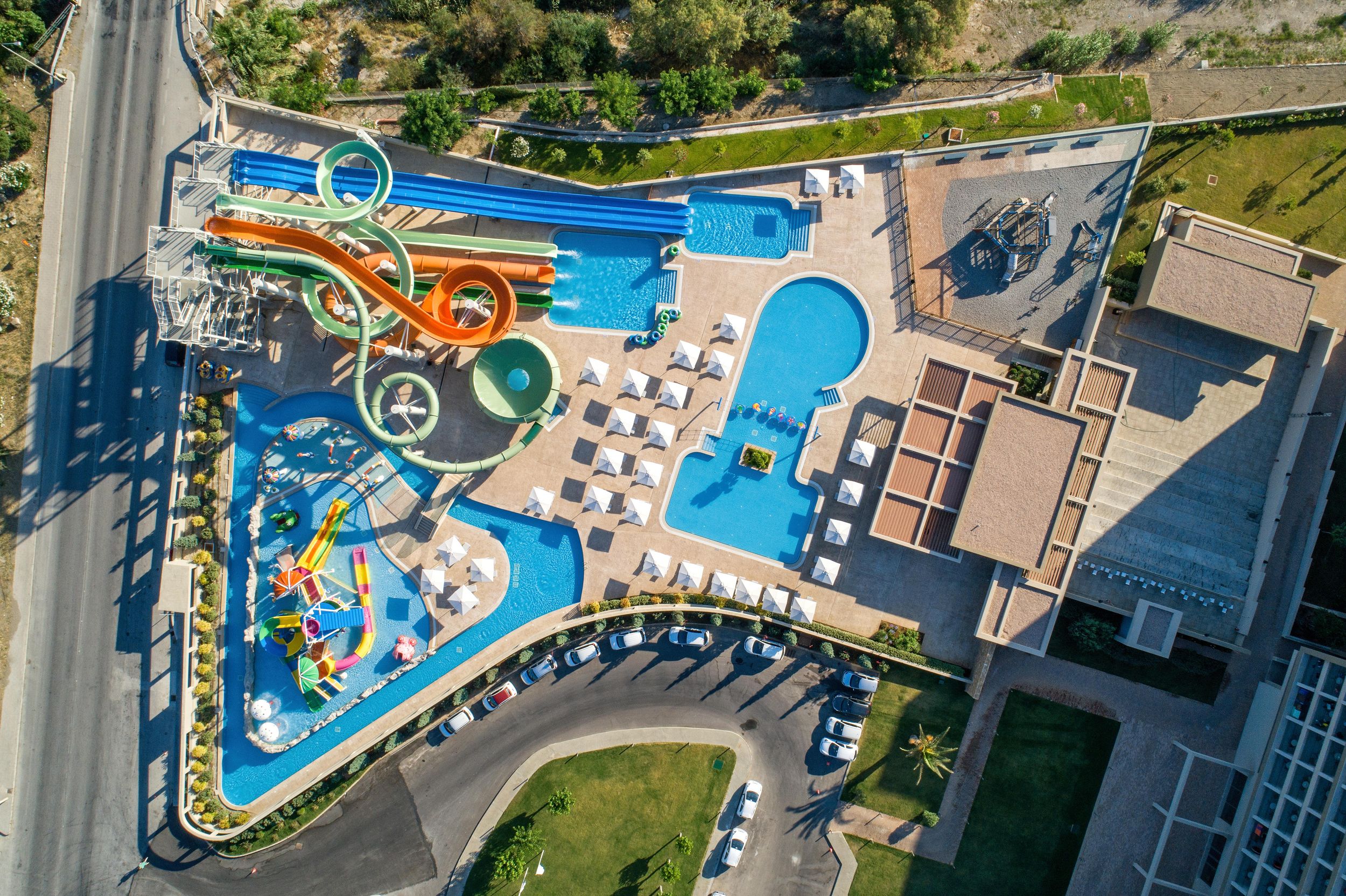 birds eye view of hotel in rhodes with water slides and parks visible