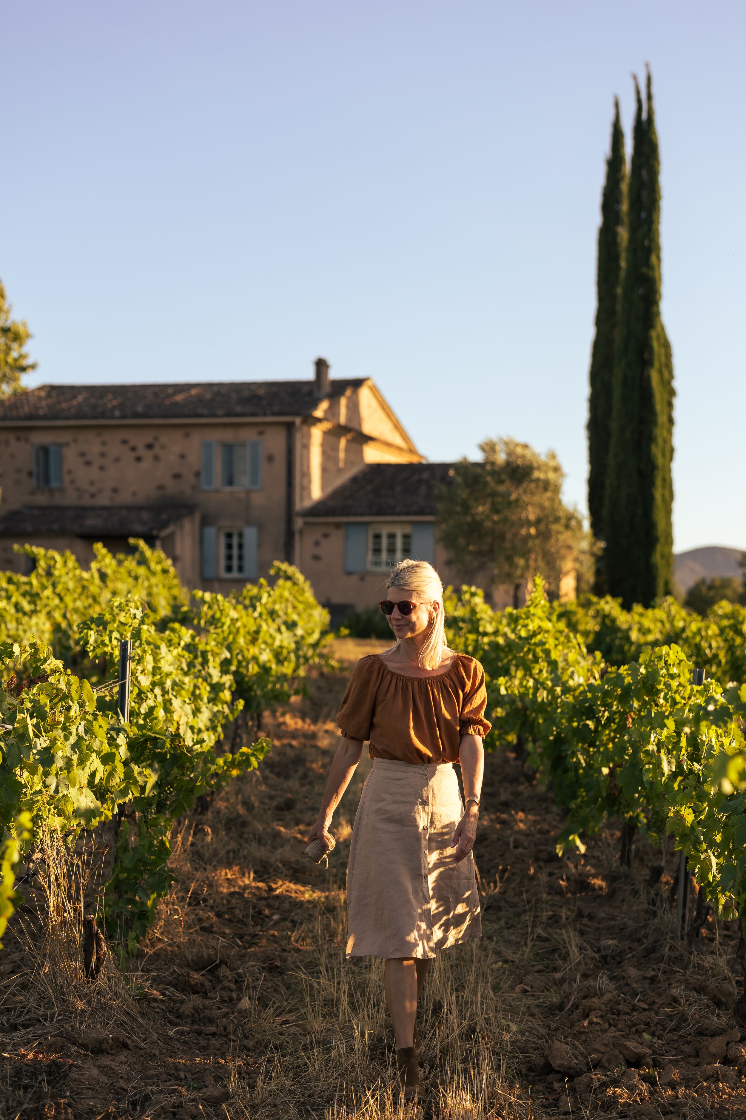Jeany walking through the gardens of Domaine Mirabeau Provençal manor house