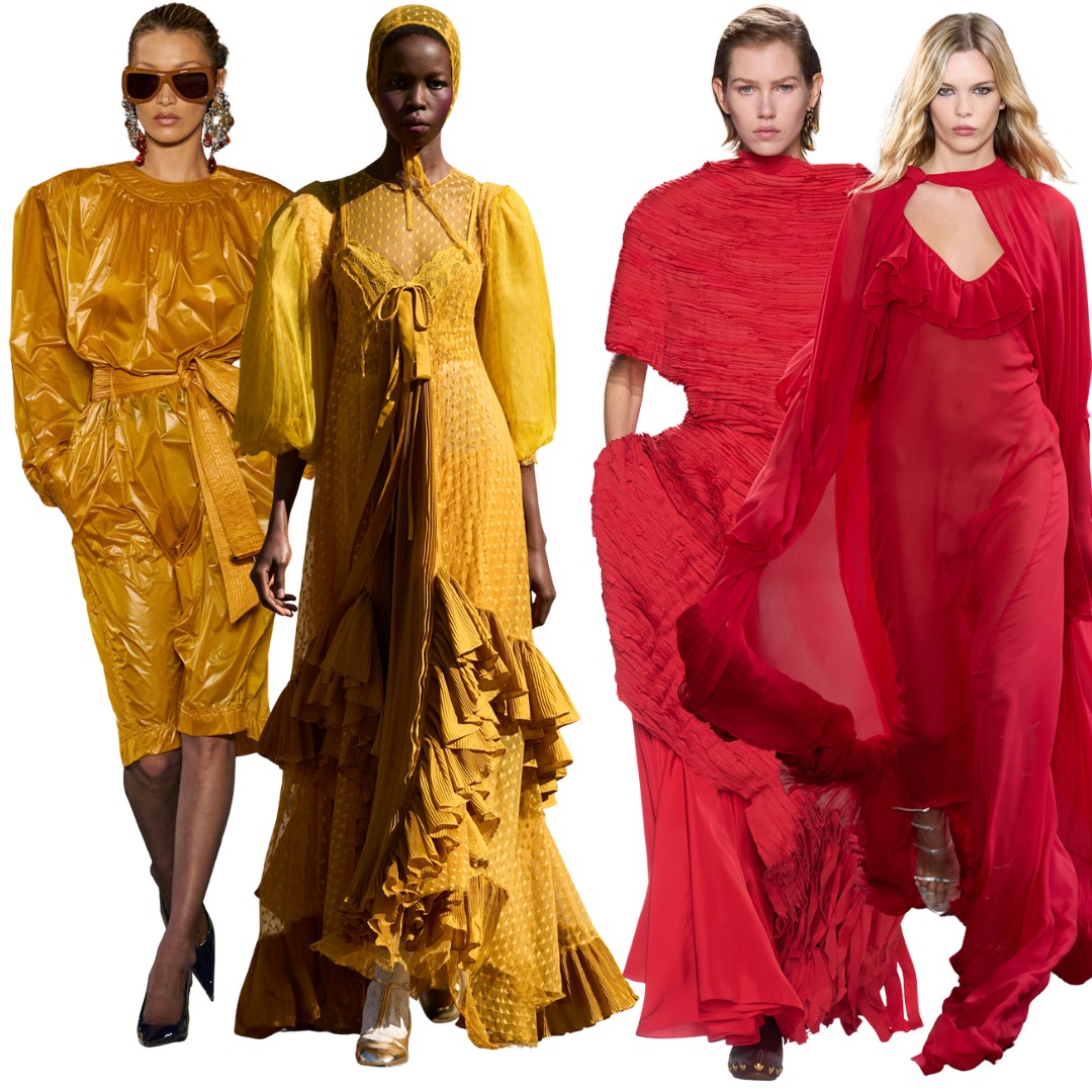 Two models wear bold mustard colours and two wear bright red as they walk down the runway
