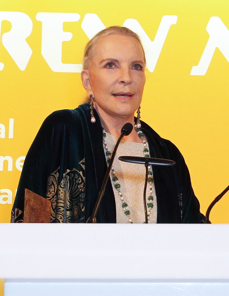 Princess Michael of Kent speaking in front of a yellow background