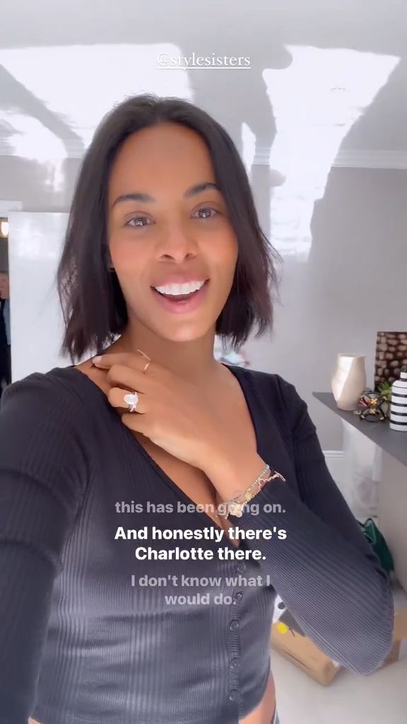 Rochelle Humes standing inside her modern white and grey kitchen inside her rental home