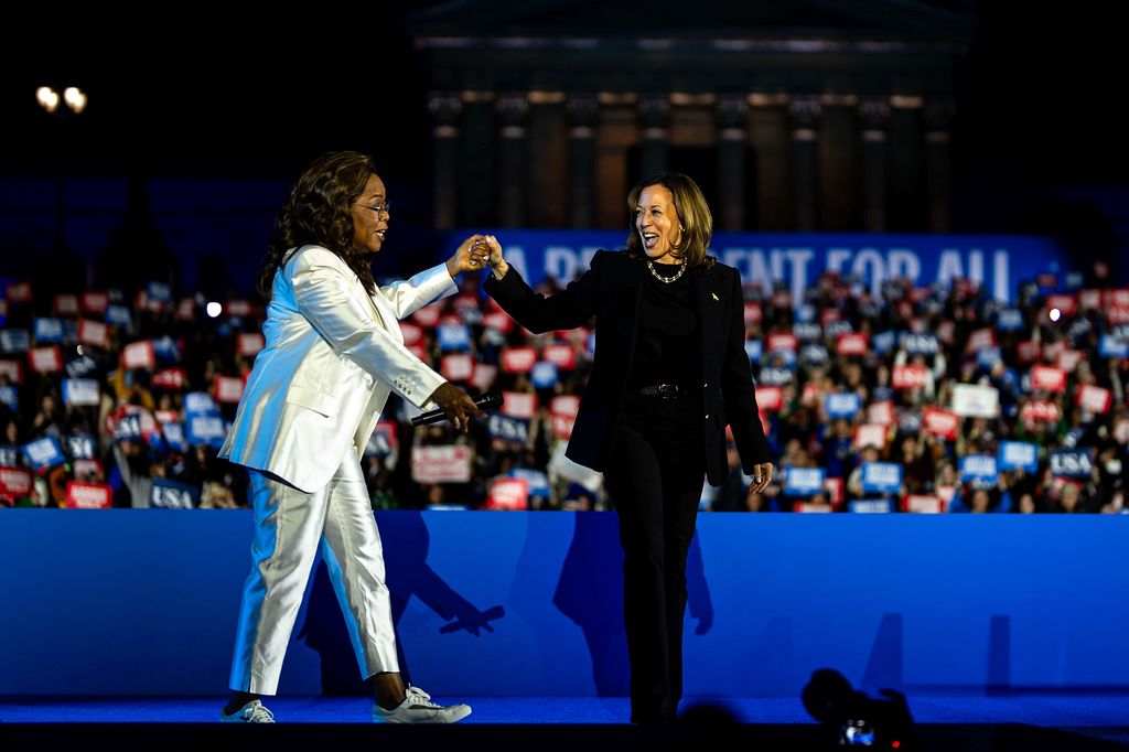 Kamala Harris (R) speaks alongside Oprah Winfrey during the closing rally of her campaign at the base of the iconic "Rocky Steps" at the Philadelphia Museum of Art on November 05, 2024 in Philadelphia, Pennsylvania