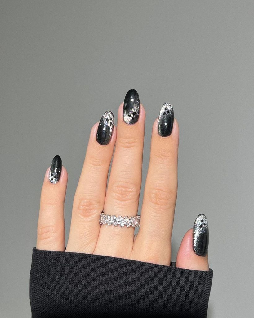 Black nails with glitter ghosts 