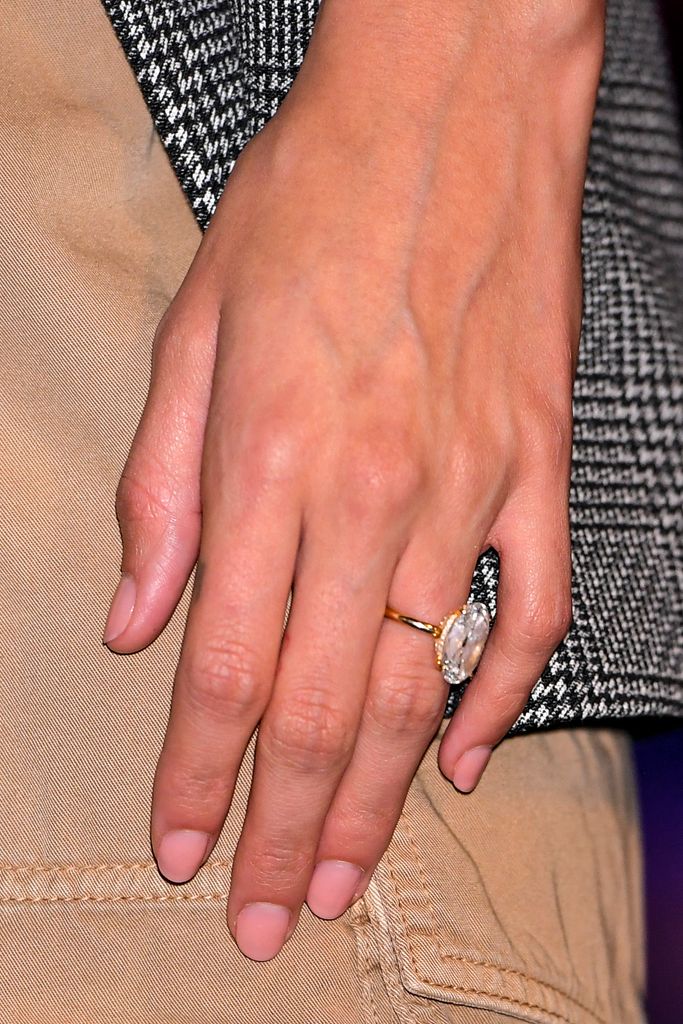 Close up of Hailey Bieber's hand with diamond ring
