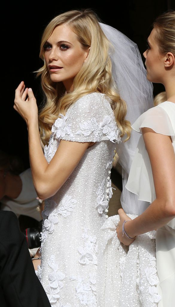 Poppy Delevingne looking over her shoulder on her wedding day