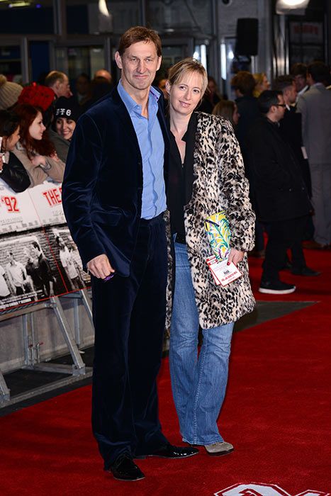 Tony Adams posing alongside his wife Poppy Teacher on the red carpet