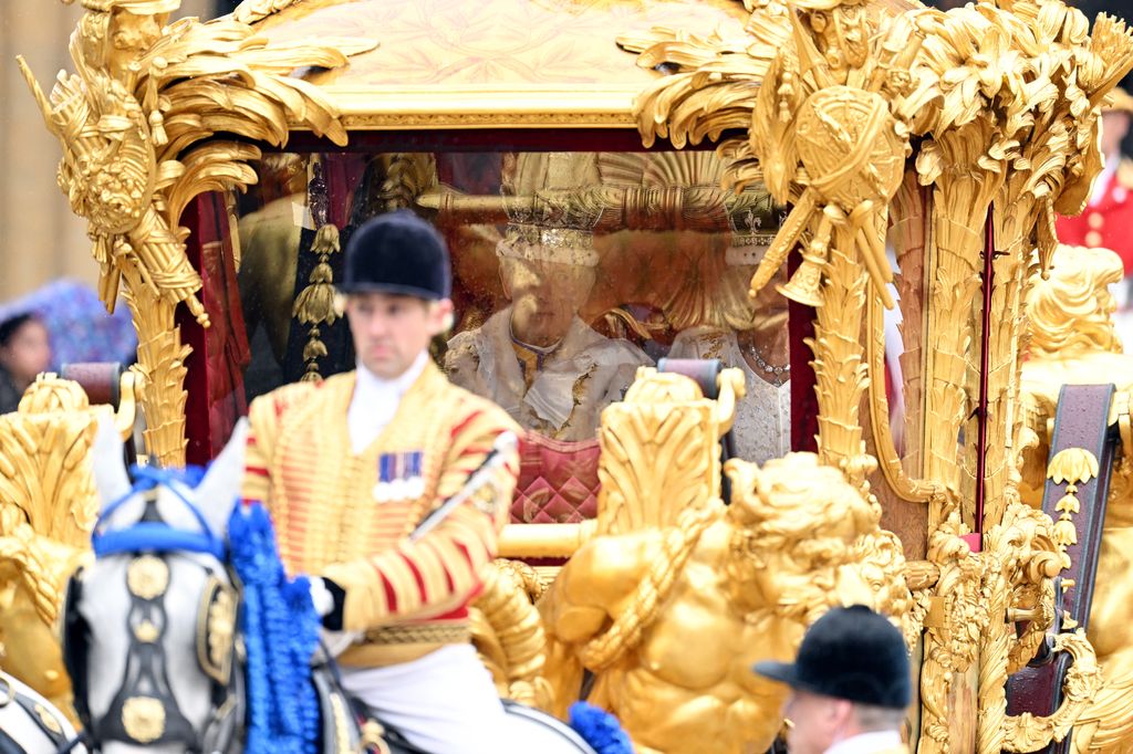 King Charles III and Queen Camilla travelling in the Gold State Coach 