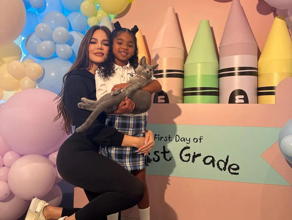 Khloe cuddles her daughter True on her first day of school