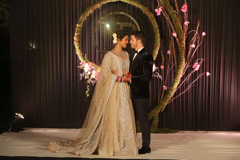  Priyanka Chopra in a golden dress at her wedding reception with Nick Jonas