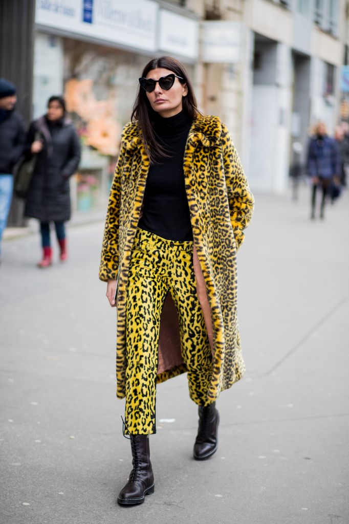 Giovanna Battaglia Engelbert This look brings bold vibes with a long, leopard-print coat paired with matching pants, making a statement while keeping warm.