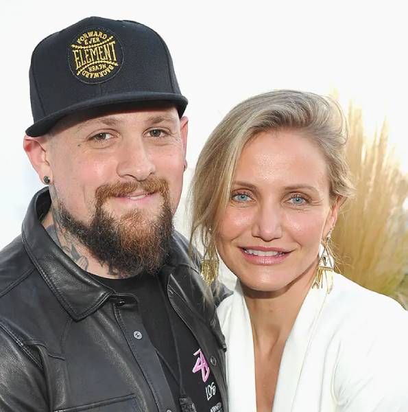 Cameron Diaz and Benji Madden smile for the cameras during rare public outing