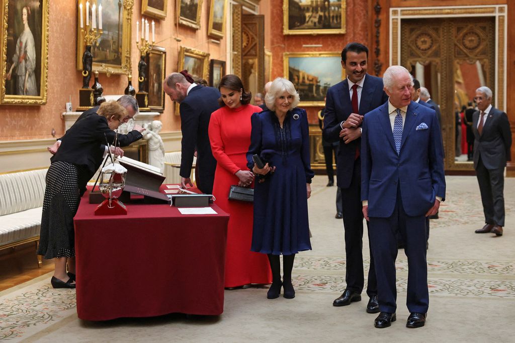 royals viewing artefacts in gallery 