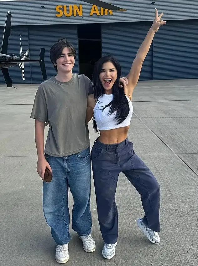 Lauren proudly poses beside teen son Evan