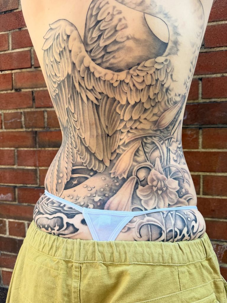 photo of ella emhoff huge swan tattoo on back